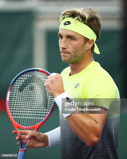 Liam Broady of Great Britain celebrates winning the first set tie break against Bjorn Fratangelo of the United States in their first round match...