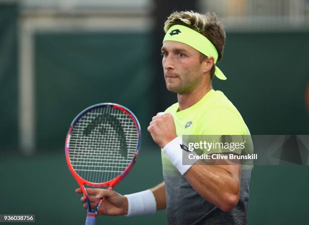 Liam Broady of Great Britain celebrates winning the first set tie break against Bjorn Fratangelo of the United States in their first round match...