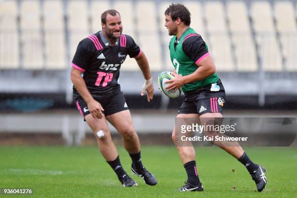 Tim Perry looks on as Ben Funnell charges forward during the Crusaders Super Rugby captain's run at AMI Stadium on March 22, 2018 in Christchurch,...
