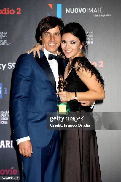 Davide Devenuto and Serena Rossi pose with the Best Original Song Award at the end of the 62nd David Di Donatello awards ceremony on March 21, 2018...