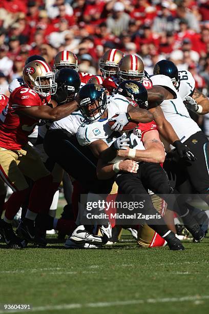 Maurice Jones-Drew of the Jacksonville Jaguars fights for yardage during the NFL game against the San Francisco 49ers at Candlestick Park on November...