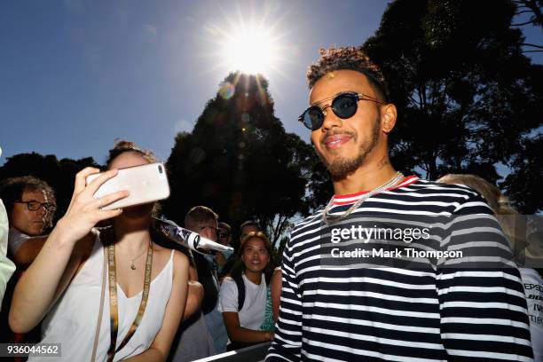 Lewis Hamilton of Great Britain and Mercedes GP arrives at the circuit during previews ahead of the Australian Formula One Grand Prix at Albert Park...