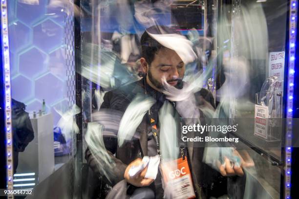 An attendee plays a game at the Enjin Coin PTE Ltd. Booth during the Game Developers Conference in San Francisco, California, U.S., on Wednesday,...