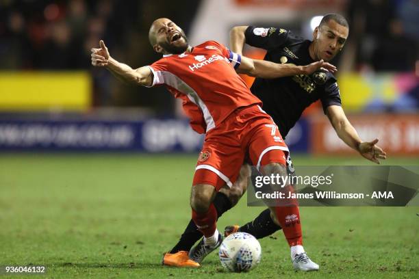 Adam Chambers of Walsall is fouled by James Vaughan of Wigan Athletic during the Sky Bet League One match between Wigan Athletic and Walsall at...