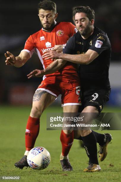 Florent Cuvelier of Walsall and Will Grigg of Wigan Athletic during the Sky Bet League One match between Wigan Athletic and Walsall at Banks' Stadium...