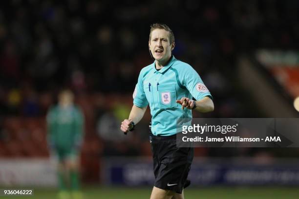 Match referee John Brooks during the Sky Bet League One match between Wigan Athletic and Walsall at Banks' Stadium on March 23, 2018 in Walsall,...