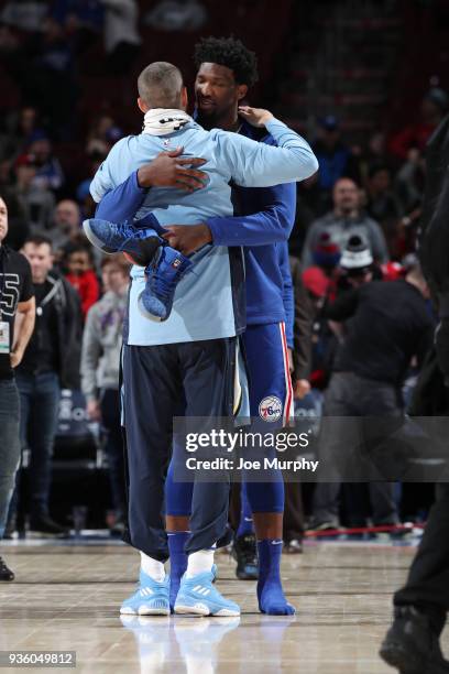 Chandler Parsons of the Memphis Grizzlies and Joel Embiid of the Philadelphia 76ers hug after the game between the two teams on March 21, 2018 at the...