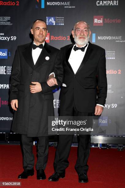 Elio Germano and Renato Carpentieri walk a red carpet ahead of the 62nd David Di Donatello awards ceremony on March 21, 2018 in Rome, Italy.