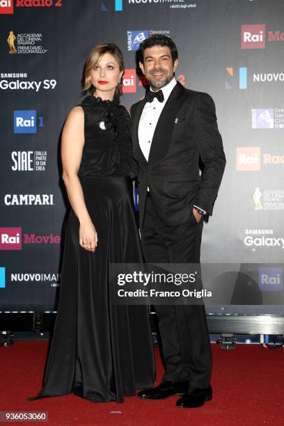 Pierfrancesco Favino and Anna Ferzetti walk a red carpet ahead of the 62nd David Di Donatello awards ceremony on March 21, 2018 in Rome, Italy.