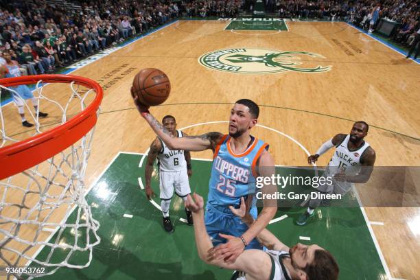 Austin Rivers of the Los Angeles Clippers shoots against Tyler Zeller of the Milwaukee Bucks during the NBA game on March 21, 2018 at the BMO Harris...