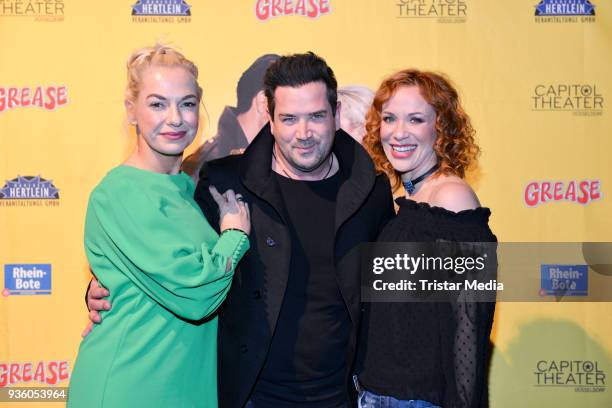 Sam Eisenstein and his wife Mareike Eisenstein and Madlen Kaniuth attend the 'Grease' premiere on March 21, 2018 in Duesseldorf, Germany.