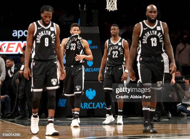Allen Crabbe of the Brooklyn Nets and teammates react late in the fourth quarter against the Charlotte Hornets during their game at Barclays Center...