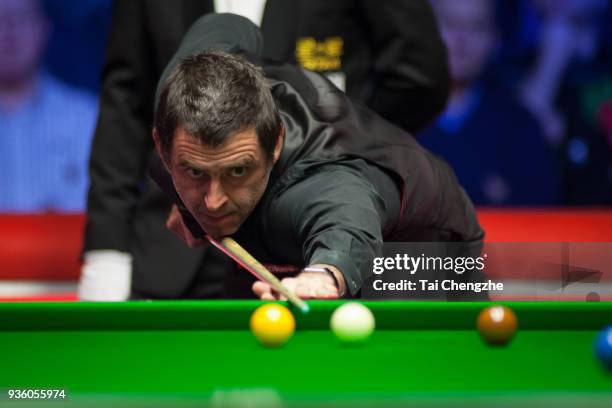 Ronnie O'Sullivan of England plays a shot during his quarter-final match against Ding Junhui of China on day three of 2018 Ladbrokes Players...