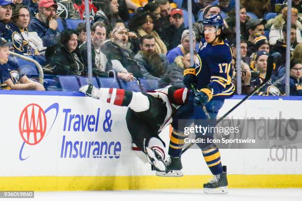 Arizona Coyotes Defenseman Luke Schenn is airborne after check from Buffalo Sabres Left Wing Jordan Nolan during the Arizona Coyotes and Buffalo...