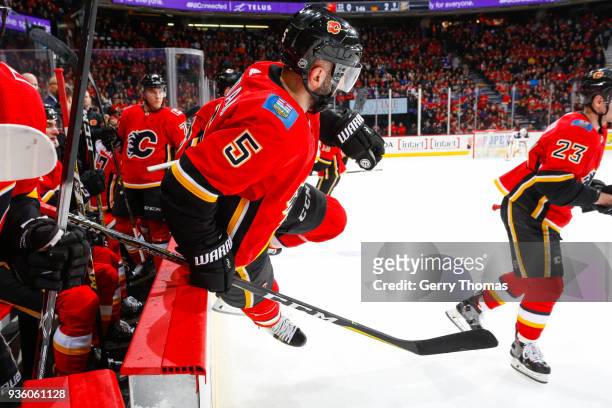 Mark Giordano of the Calgary Flames jumps to the ice in an NHL game on March 21, 2018 at the Scotiabank Saddledome in Calgary, Alberta, Canada.