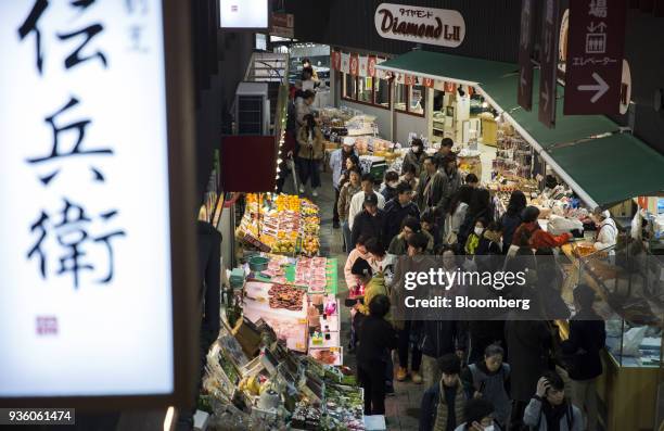 People walk through Omicho Market in Kanazawa, Japan, on Monday, March 19, 2018. Japan is scheduled to release February's Consumer Price Index...