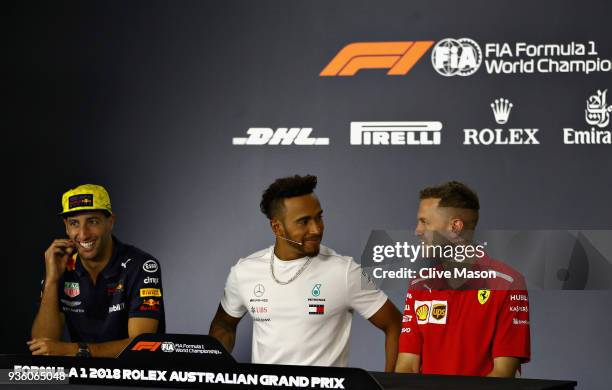 Daniel Ricciardo of Australia and Red Bull Racing, Lewis Hamilton of Great Britain and Mercedes GP and Sebastian Vettel of Germany and Ferrari in the...