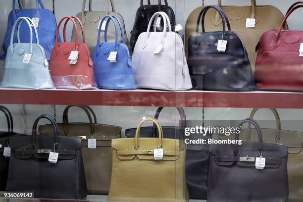 Second-hand Hermes International SCA Bolide and Birkin handbags are displayed for sale at a Daikokuya Inc. Store in the Shinjuku district of Tokyo,...