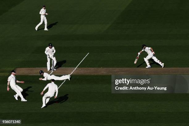Tom Latham of New Zealand runs back to his crease during day one of the First Test match between New Zealand and England at Eden Park on March 22,...