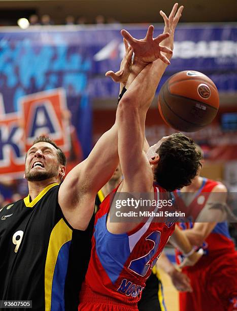 Jared Homan, #9 of Maroussi BC competes with Sasha Kaun, #24 of CSKA Moscow in action during the Euroleague Basketball Regular Season 2009-2010 Game...