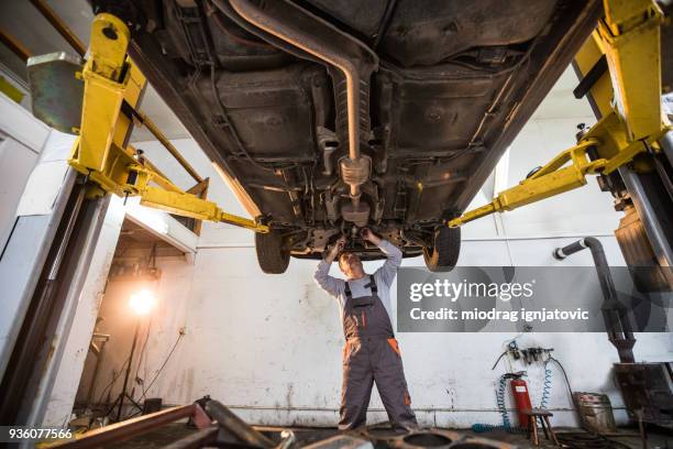 auto mechanic on the job - chassis stock pictures, royalty-free photos & images