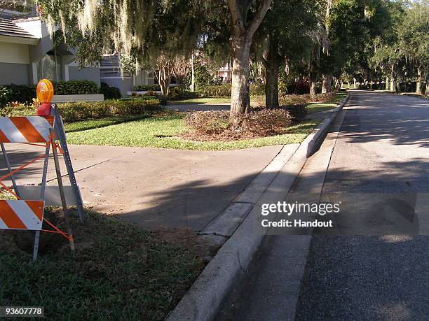 In this handout photo provided by The Florida Highway Patrol, the street where Tiger Woods crashed his SUV is seen on December 2, 2009 in Windermere,...