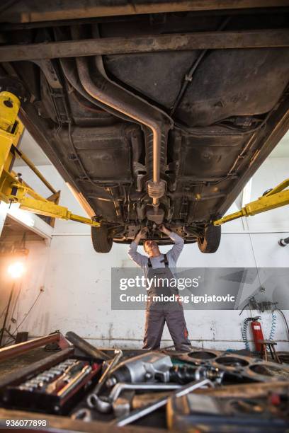 Fixing The Problem Under The Car High-Res Stock Photo - Getty Images