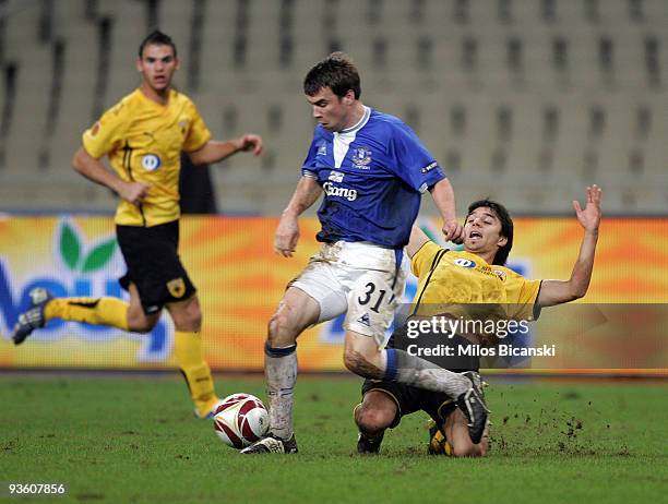 Nacho Scocco of AEK Athens competes with Seamus Coleman of Everton during the Europa League Match between AEK Athens and Everton at Spyros Louis...