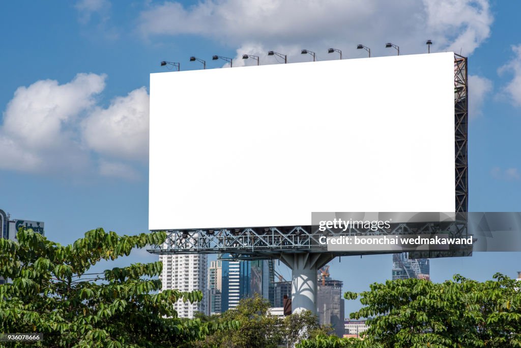 Road with lanterns and large blank billboard at evening in city : Bangkok : Thailand