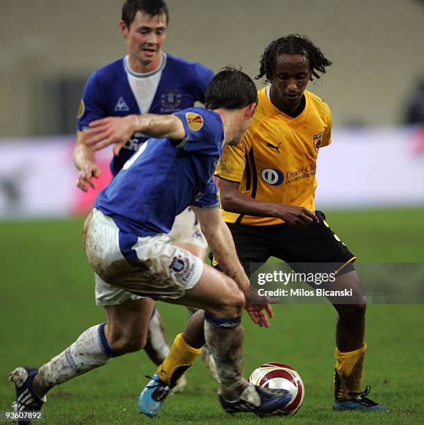 Youssouf Hersi of AEK Athens competes with Diniyar Bilyaletdinov of Everton during the Europa League Match between AEK Athens and Everton at Spyros...