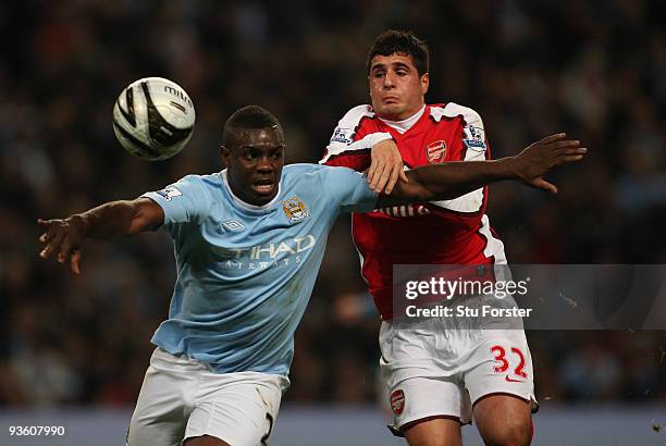 Micah Richards of Man City battles with Carlos Velas of Arsenal during the Carling Cup quarter final match between Manchester City and Arsenal at...