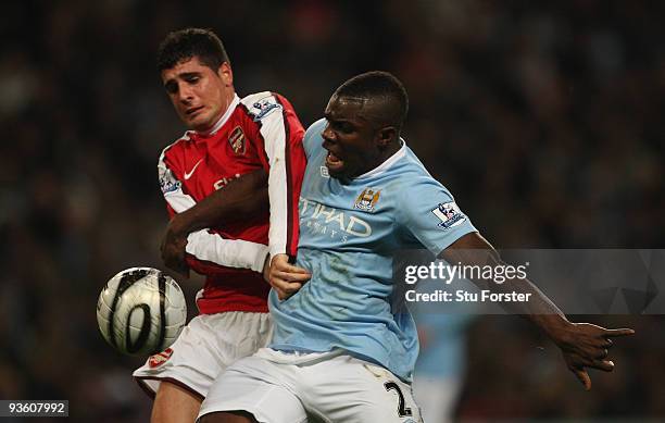 Micah Richards of Man City battles with Carlos Velas of Arsenal during the Carling Cup quarter final match between Manchester City and Arsenal at...