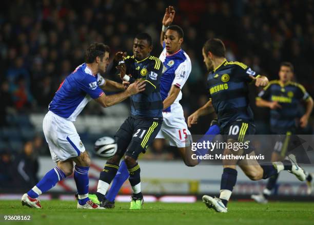 Salomon Kalou of Chelsea is challenged by Ryan Nelsen and Steven Nzonzi of Blackburn Rovers during the Carling Cup Quarter Final match between...