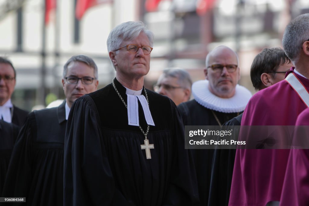 A group of Evangelical pastors and bishops walk in the...