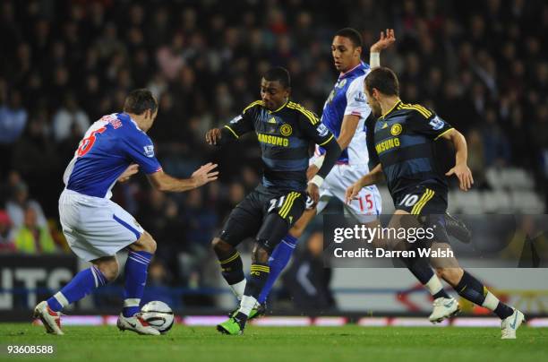 Salomon Kalou of Chelsea is challenged by Ryan Nelsen and Steven Nzonzi of Blackburn Rovers during the Carling Cup Quarter Final match between...