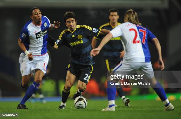 Deco of Chelsea competes for the ball with Steven Nzonzi of Blackburn Rovers during the Carling Cup Quarter Final match between Blackburn Rovers and...