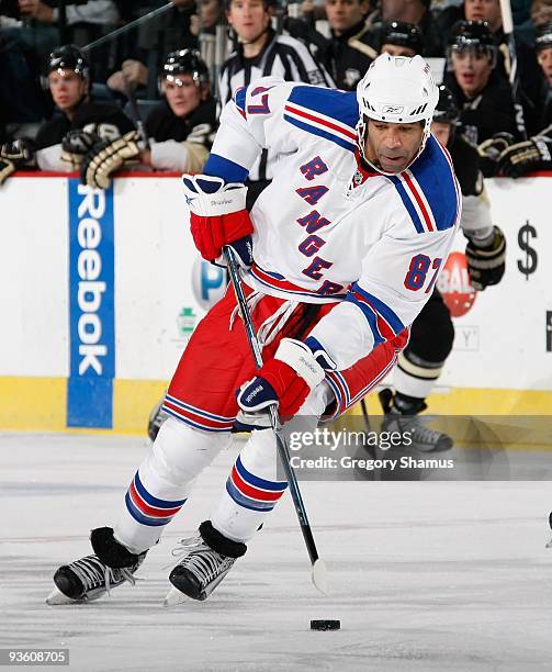 Donald Brashear of the New York Rangers controls the puck against the Pittsburgh Penguins on November 28, 2009 at the Mellon Arena in Pittsburgh,...