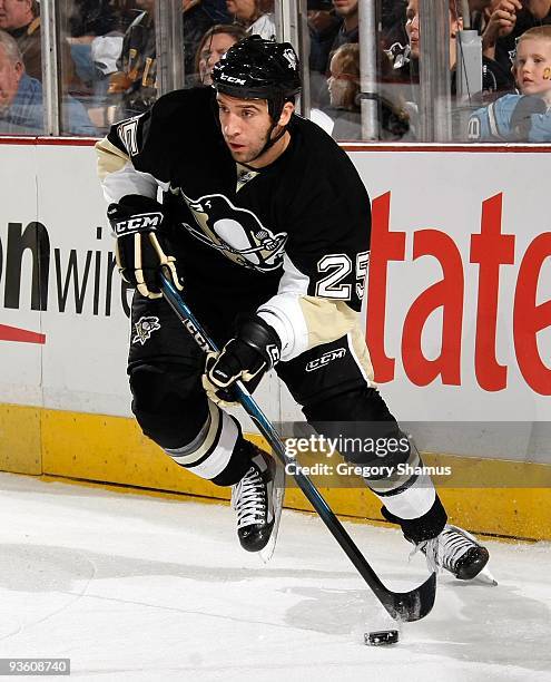 Maxime Talbot of the Pittsburgh Penguins moves the puck against the New York Rangers on November 28, 2009 at the Mellon Arena in Pittsburgh,...