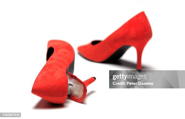 red stiletto broken heel - red shoe stockfoto's en -beelden