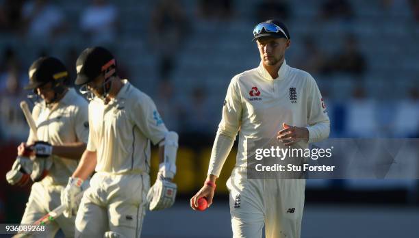 England captain Joe Root looks on as the New Zealand batsmen Tom Latham and Kane Williamson leave the field for the dinner break during the First...