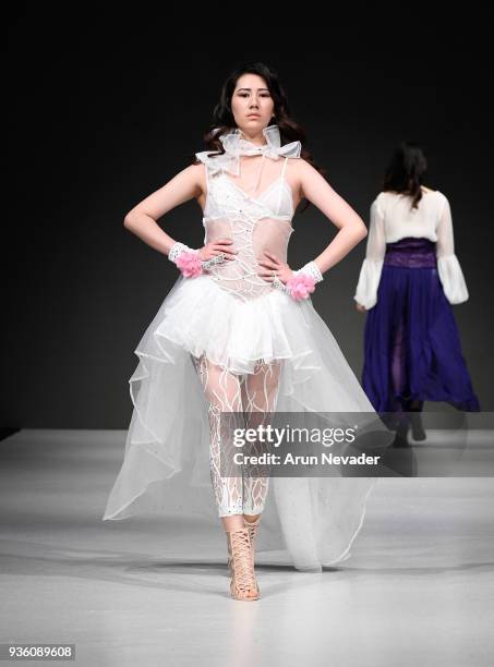 Model walks the runway wearing Si Mee Collections at 2018 Vancouver Fashion Week - Day 2 on March 20, 2018 in Vancouver, Canada.