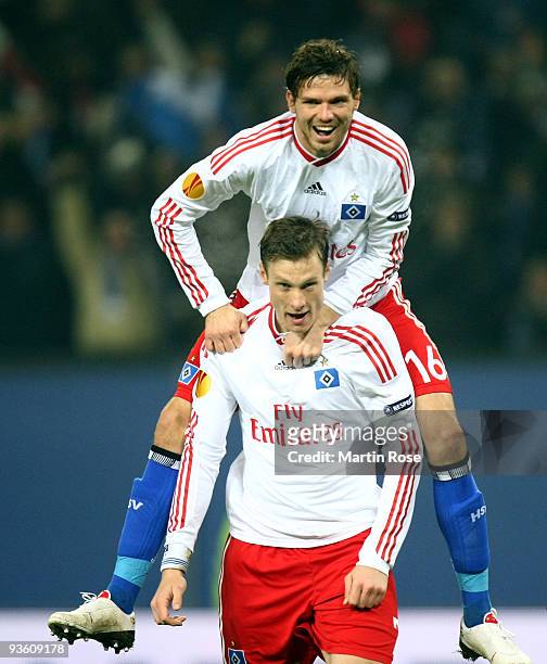 Marcell Jansen of Hamburg celebrates after scoring his team's first goal with team mate Marcus Berg during the UEFA Europa League Group C match...