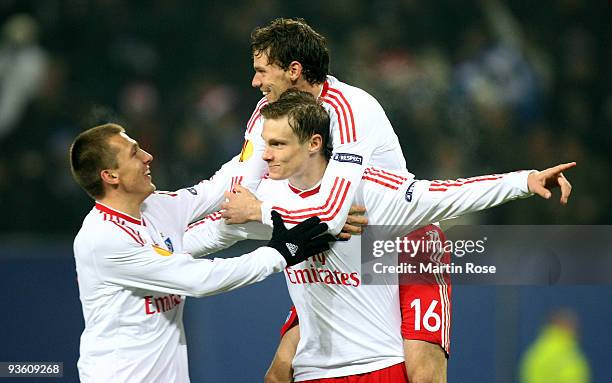 Marcell Jansen of Hamburg celebrates after scoring his team's first goal with team mates Robert Tesche and Marcus Berg during the UEFA Europa League...