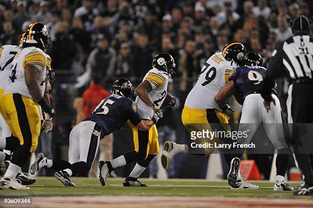 Jarrett Johnson of the Baltimore Ravens tackles Dennis Dixon of the Pittsburgh Steelers at M&T Bank Stadium on November 29, 2009 in Baltimore,...