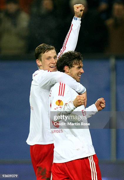 Marcus Berg of Hamburg celebrates after scoring his team's second goal with team mate Marcell Jansen during the UEFA Europa League Group C match...