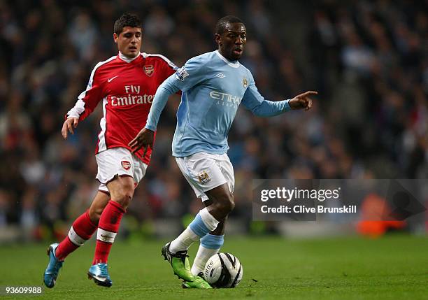 Shaun Wright-Phillips of Manchester City moves away from Fran Merida of Arsenal during the Carling Cup quarter final match between Manchester City...