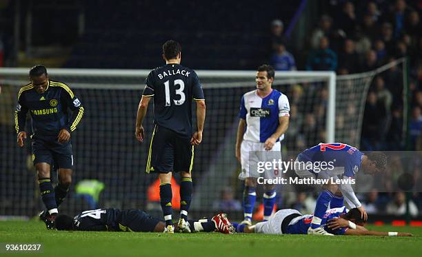 Steven Nzonzi of Blackburn Rovers and Gael Kakuta of Chelsea lie injured after colliding during the Carling Cup Quarter Final match between Blackburn...