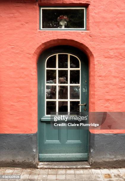 green painted door with glass panel - claire plumridge stock-fotos und bilder