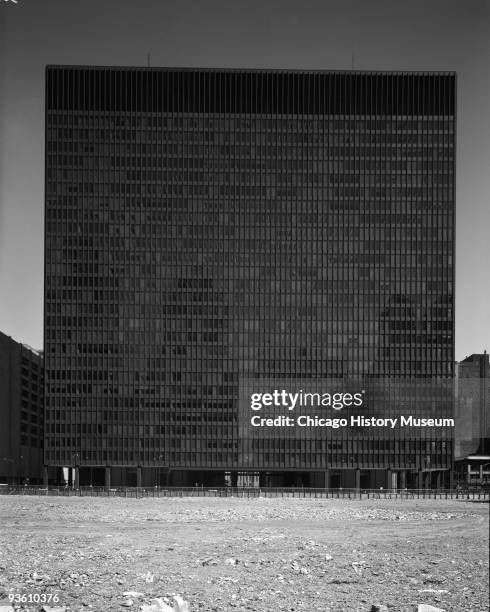 Views of Dirksen Federal Building of the Chicago Federal Center View from across vacant lot covered with gravel, no reflection, Chicago, IL, ca.1960s.