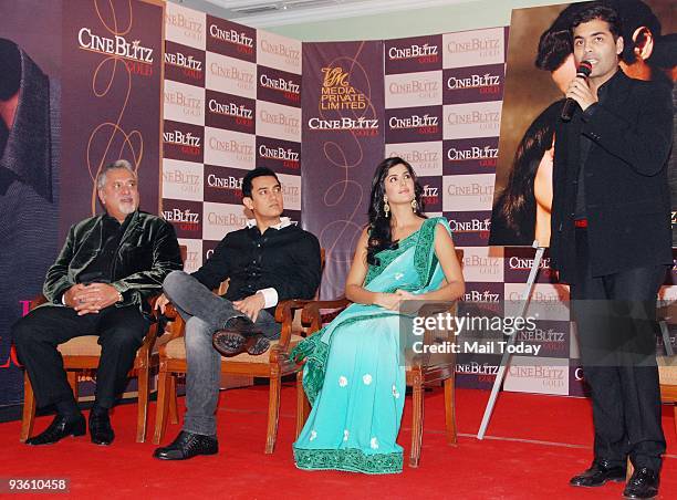 Business Tycoon Vijay Mallya along with actors Aamir Khan, Katrina Kaif and Karan Johar during the launch of Cine Blitz magazine's new book 'Love and...